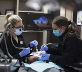 Woman with nitrous oxide nose mask